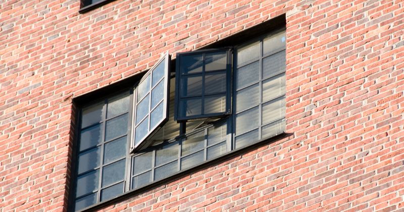 Side Hung Casement Windows installed on a house with brown bricks Description: