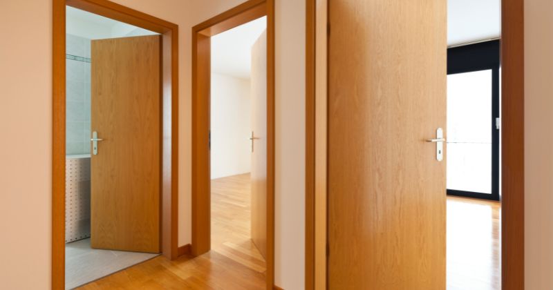 Smooth wooden door frame detail installed in several rooms.