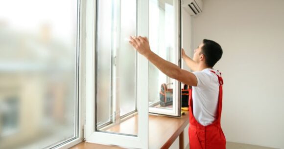 an inspecting double glazed windows in rainy weather.