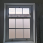 Brand new sliding sash bathroom window with frosted glass by Patchett Joinery.